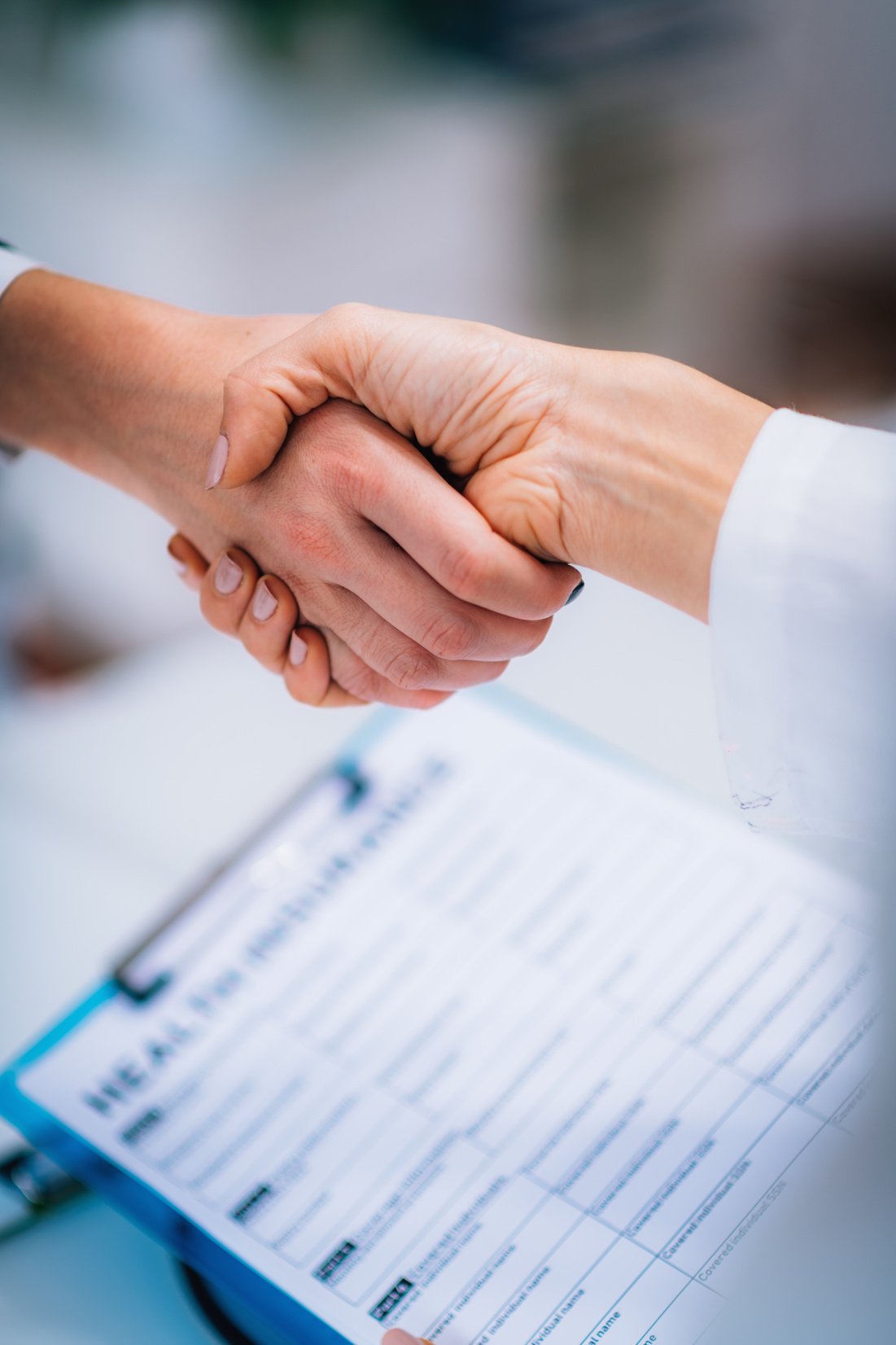 Handshake After Signing Health Insurance Form